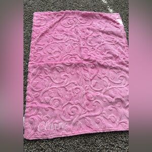 Reversible baby blanket with “Claire” on it